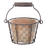 Rustic terracotta pots in wire baskets with handles, perfect for indoor plants or outdoor displays, set of 2.