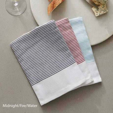 Absorbent, lint-free tea towels in Midnight, Fire, and Water; made from 100% OEKO-TEX® Certified cotton.