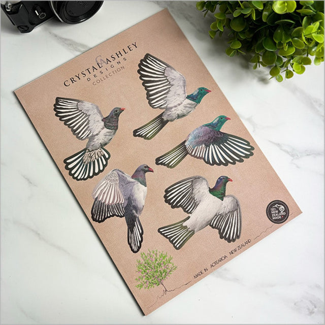 Colorful Pop Out Kereru Set wall art featuring detailed designs of the iconic New Zealand bird, perfect for vibrant home decor.