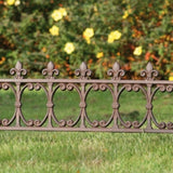 Elegant large fleur-de-lis lawn fence, enhancing gardens with security and beauty while delineating property boundaries.