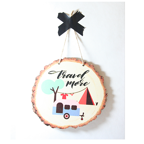Wood slice wall art featuring 'Travel More' design, crafted from eco-friendly pine veneer, perfect for inspiring adventure.