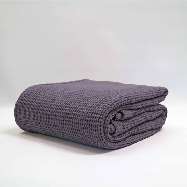 Large grape-colored stonewashed blanket with a deep waffle texture, made from 100% OEKO-TEX® cotton, perfect for cozying up.