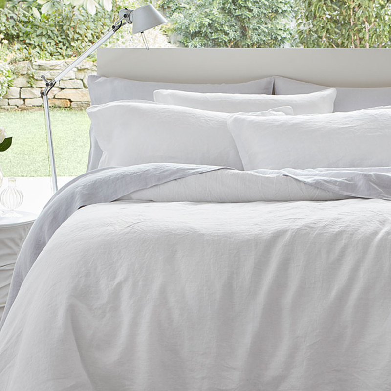 Luxurious BAKSANA Baltic Linen duvet cover set in white, made from 100% European Flax®, includes one duvet and two pillowcases.