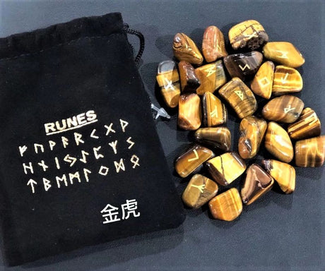 Tigers Eye Rune Set with 25 carved pieces, offering spiritual guidance and intuitive insight in beautiful golden and brown hues.