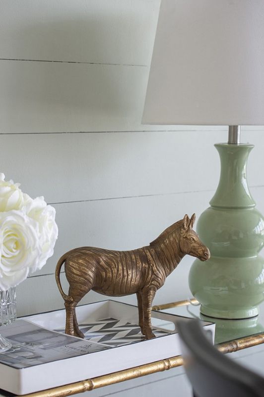 Stylish zebra statue with metallic copper finish, crafted from stone powder and resin, perfect for modern home decor.