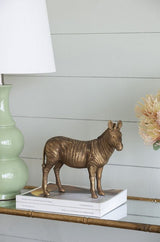 Zebra ornament with metallic copper finish, showcasing exquisite detail; a stylish centerpiece for modern home decor.