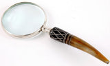 Elegant brass and aluminium magnifier with a unique horn handle, perfect for reading fine print and enhancing decor.