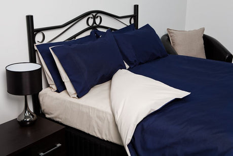 Reversible queen duvet cover in blue and oyster, featuring soft 50% polyester, 50% cotton blend for luxurious comfort.