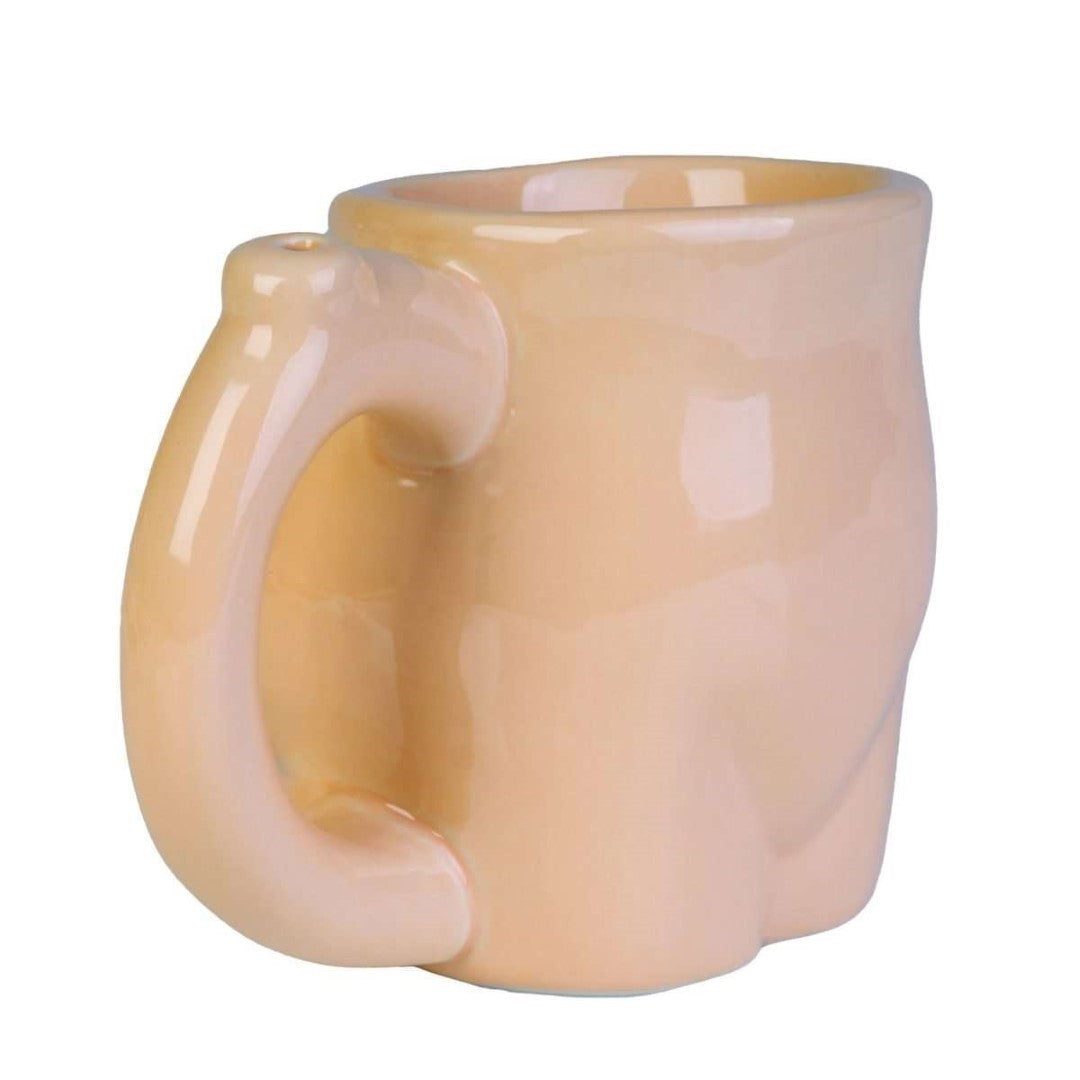 Cheeky butt-shaped coffee mug with a water pipe underneath for a humorous dual-function experience.