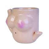 Novelty peach-hued coffee mug with a functional water pipe, merging morning coffee and cannabis enjoyment seamlessly.