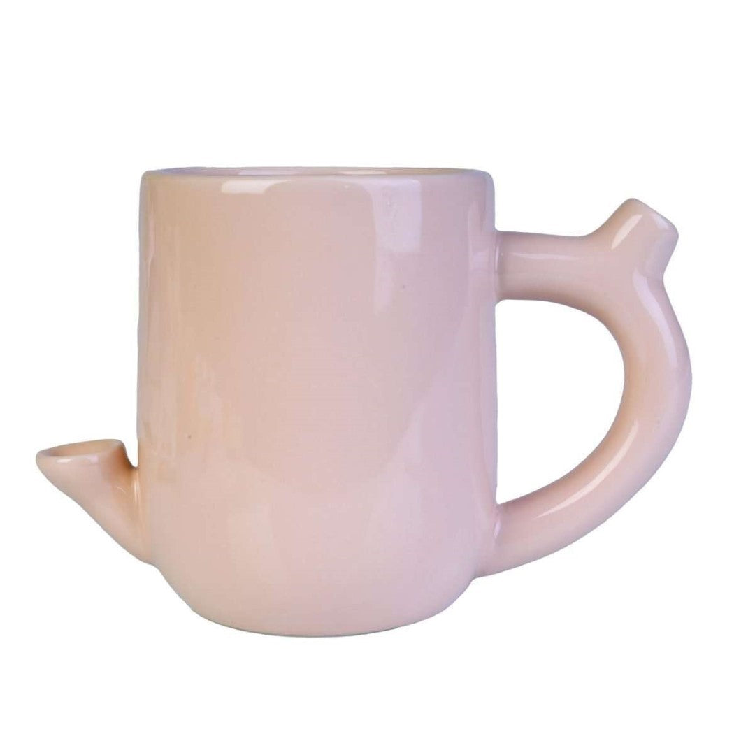 Novelty coffee mug with a fun design, featuring a functional water pipe for cannabis enjoyment, in peachy flesh tone.