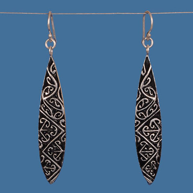 Silver plated Maori design earrings, handcrafted from brass, showcasing intricate patterns and cultural heritage, perfect for any occasion.