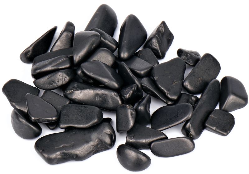 Shungite tumbled stones in a 0.5KG box, designed to absorb EMF radiation and enhance overall wellbeing.