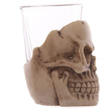 Set of 6 mini skull shot glasses, 7cm tall, perfect for Halloween parties and unique barware displays.