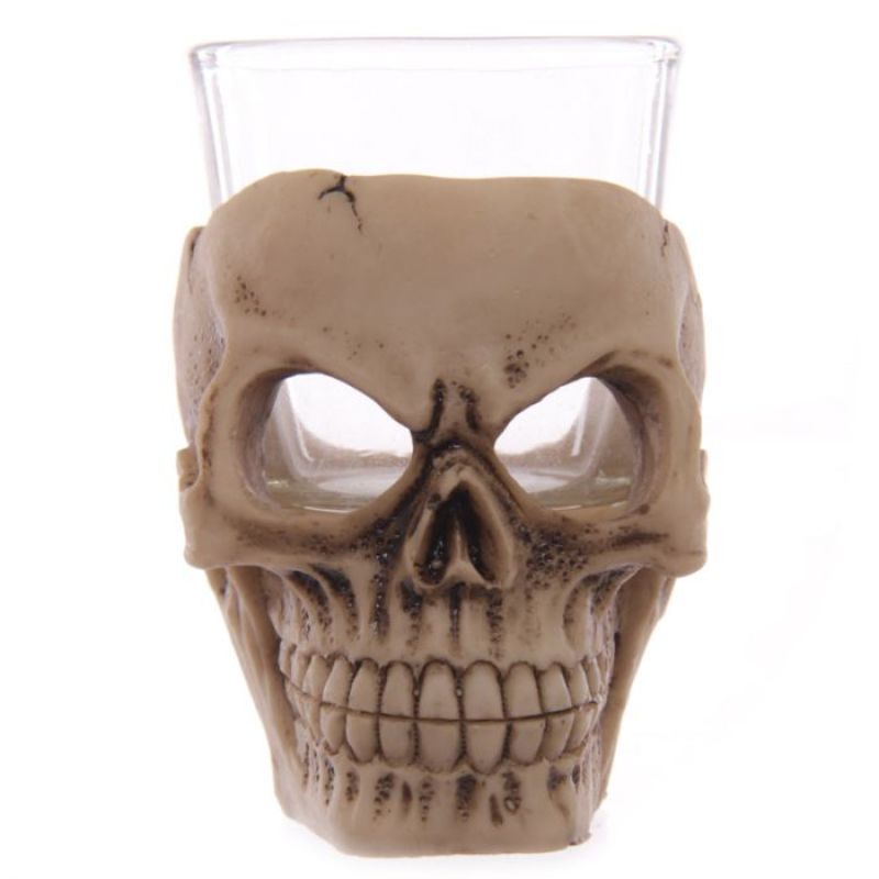 Set of 6 mini skull shot glasses, 7cm tall, perfect for spooky parties and unique barware.