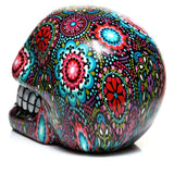 Vibrant Day of the Dead skull ornament with intricate floral designs, perfect for home decor or as a thoughtful gift.