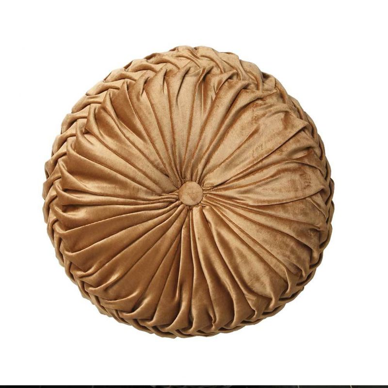 Round gold velvet cushion with ruched detailing and button, adding vintage glamour to any decor.