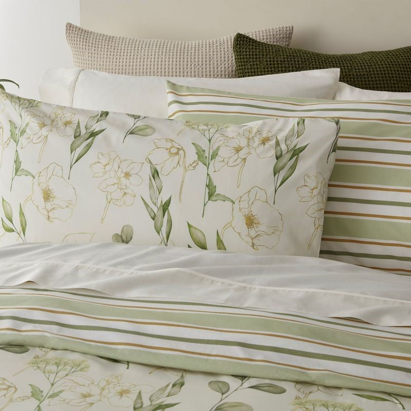 Reversible super king duvet cover set with abstract florals in green and cream, featuring gold outlines, made from certified cotton.