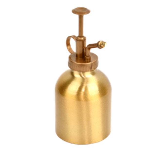 Elegant gold plant mister for indoor and outdoor use, delivering a fine spray to hydrate plants and enhance decor.