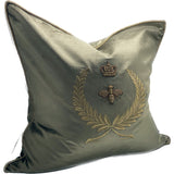 Hand-embroidered dark green and gold cushion cover, crafted from cotton and viscose, adding elegance to any room.