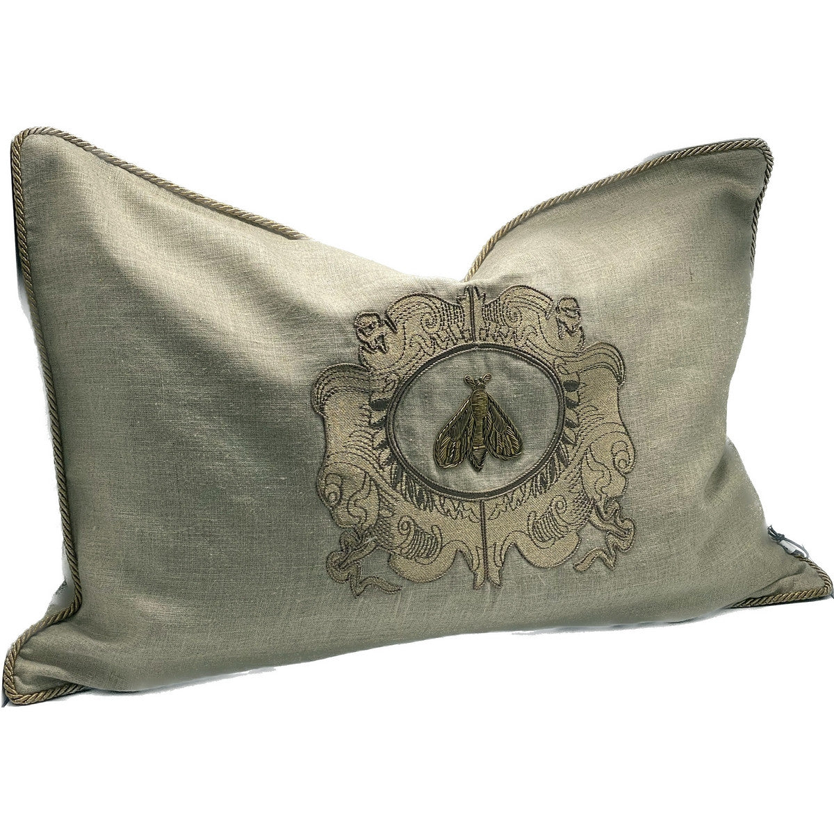 Hand-embroidered natural linen cushion cover with elegant gold zari accents, measuring 600x400, designed in New Zealand.