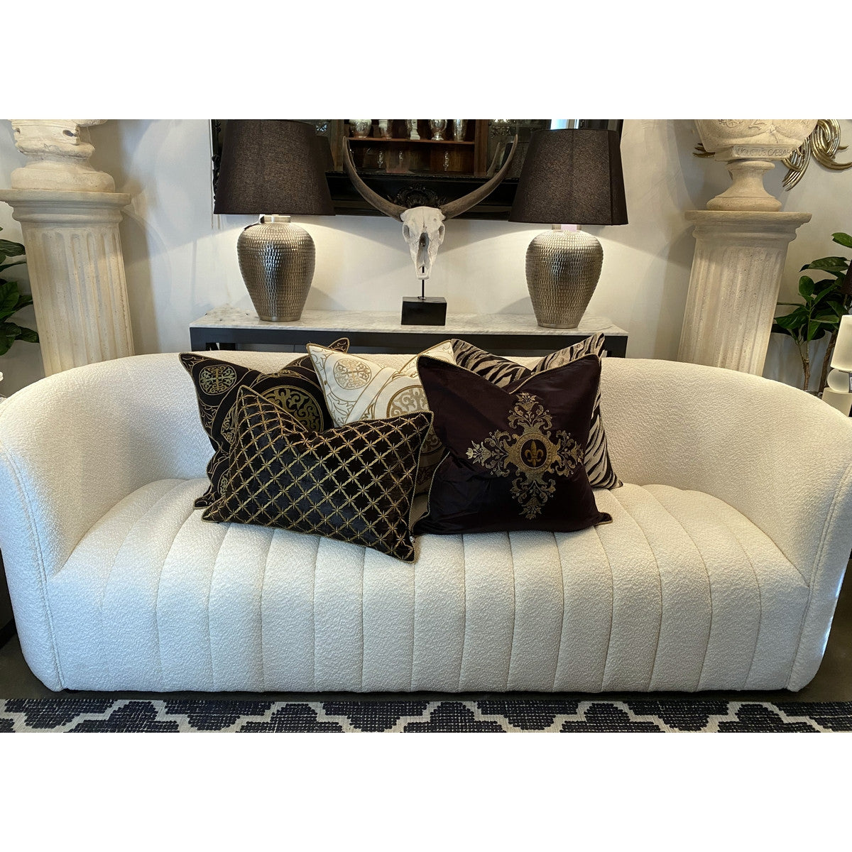 Luxurious black and gold hand-embroidered cushion cover, perfect for enhancing elegance in any living space.