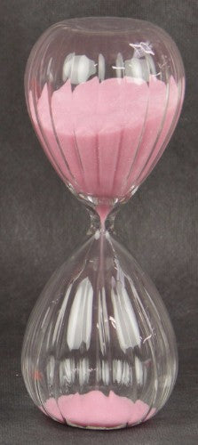 Elegant pink hourglass sand timer, 15-minute duration, perfect for decor and time management in home or office.