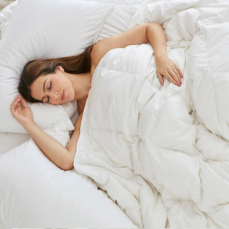 Lightweight summer duvet inner by Baksana, filled with goose down and feather, encased in Egyptian cotton for comfort.