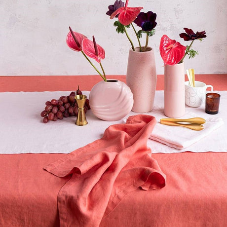 Salmon-colored linen tablecloth by Baksana, 160 x 240cm, perfect for elegant table settings.