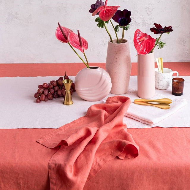 Salmon-colored linen tablecloth by Baksana, 160 x 240cm, perfect for elegant table settings.