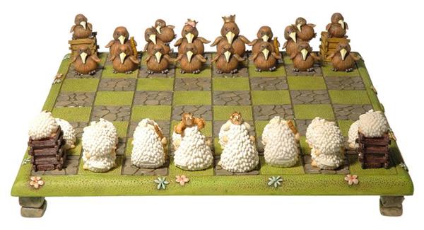 Sheep vs Kiwi Chess Set featuring whimsical sheep and kiwi pieces on a lush green board, perfect for game nights and souvenirs.