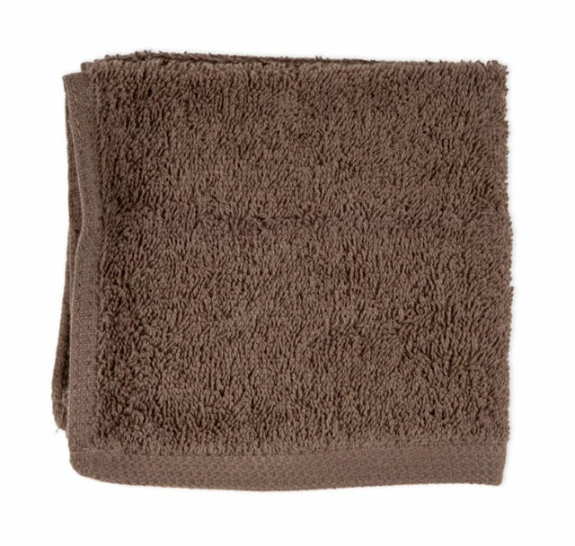 Plush walnut bath mat crafted from 100% cotton, offering softness, absorbency, and elegance for any bathroom setting.