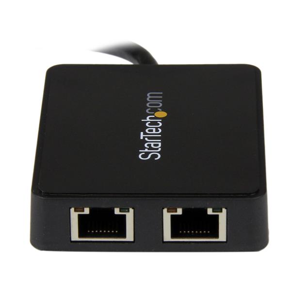 Dual port Gigabit Ethernet adapter connecting to laptop via USB 3.0, with pass-through USB port for additional devices.