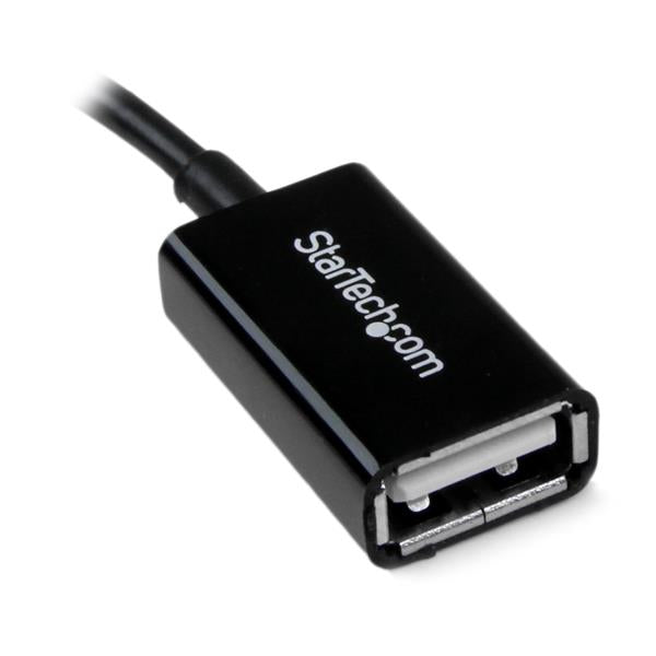 Micro USB to USB OTG adapter cable connecting devices for easy integration of USB peripherals like drives and keyboards.