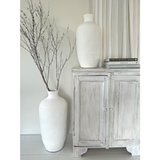 Elegant white terracotta bottle-shaped urn (54cm) for stylish decor, perfect for dried flowers or solo display.