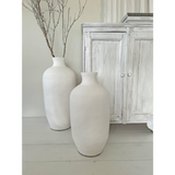 White medium Lombok Bottle (54cm) made of terracotta; stylish urn for decor, perfect for flowers or as a standalone accent.