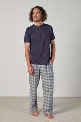 Casual PJ set with t-shirt and pants, featuring elastic waistband and pockets, made from certified cotton, ethically produced.