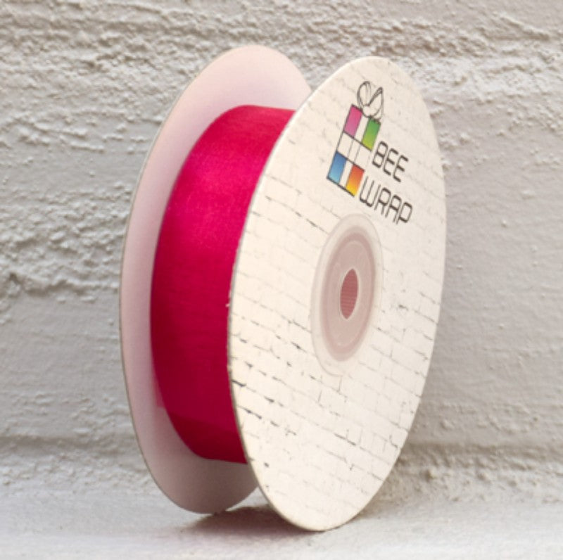 Hot pink organza ribbon, 25mm wide and 50m long, perfect for decorations and crafts.