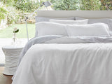 Luxurious white Baltic linen duvet cover set with matching pillowcases, crafted for comfort and eco-friendliness.