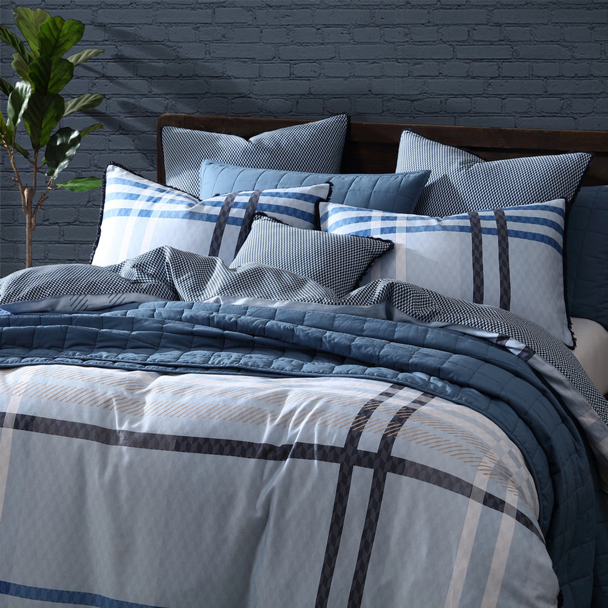 Yarmouth Blue duvet cover set for queen bed, featuring oversized tartan print, cotton sateen material, and unique fray edge trim.