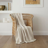 Lightweight reversible throw in cream and beige stripes, perfect for cooler evenings, made of 100% cotton.