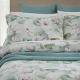 Duvet cover set featuring a serene Water Lilies print on white, with pale green reverse; includes two pillowcases.