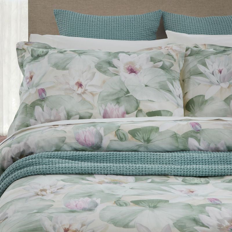 Duvet cover set featuring a serene water lilies print, pale green reverse, and includes two standard pillowcases.