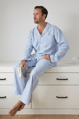 Blue and white striped classic pyjama set featuring a long sleeve top and elasticated pants with pockets, ethically made.