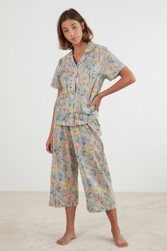 Green floral Capri PJ set by Baksana, featuring a button-up top and drawstring cropped pants, made from 100% cotton.