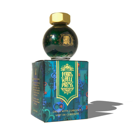 Enchanting 20ml glass globe of Ferritales Green fountain pen ink, featuring emerald hue with shimmering red and blue tones.