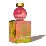Ferris Wheel Press Bumbling Blossom fountain pen ink in a 20ml glass globe, featuring a duochrome pink-to-green shimmer.