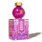 Bright purple fountain pen ink with duochrome pink shimmer, perfect for creative writing and artistic projects.