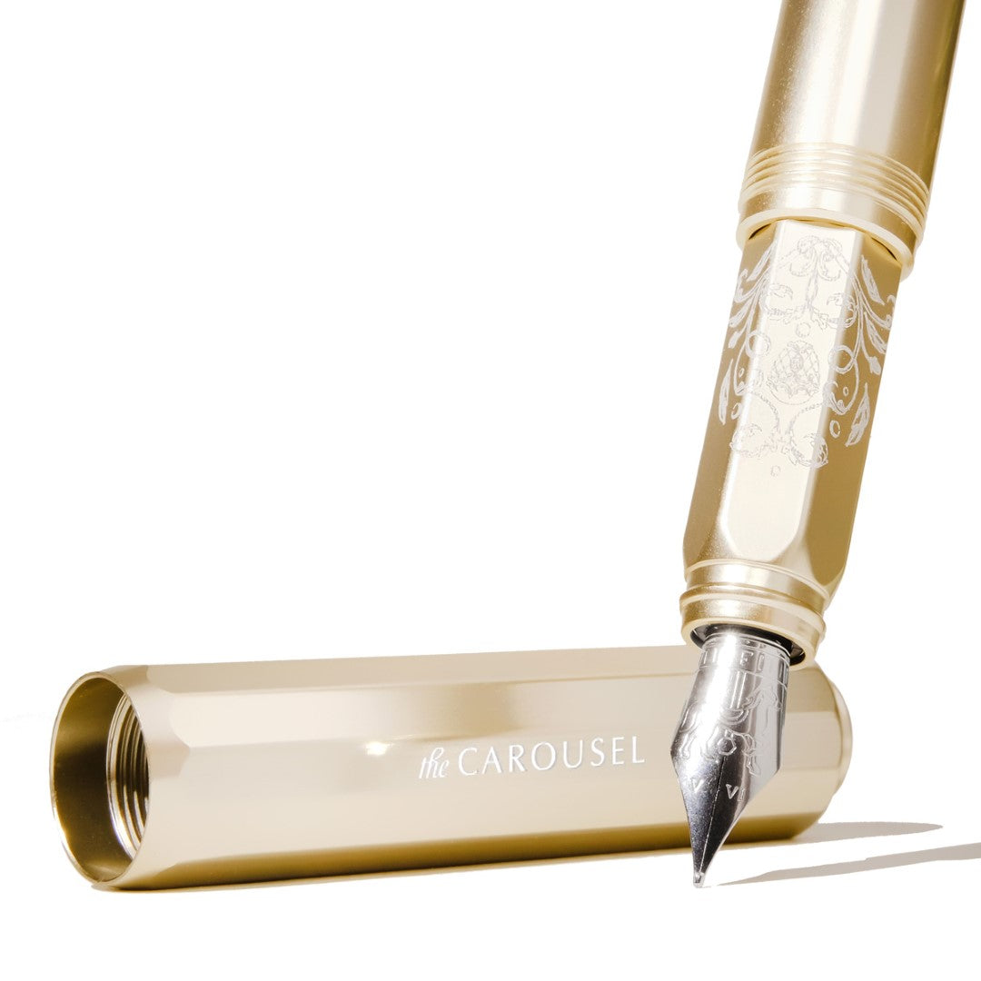 Champagne gold Ferris Wheel Press fountain pen with fine nib, made of aircraft-grade aluminum, perfect for elegant writing.