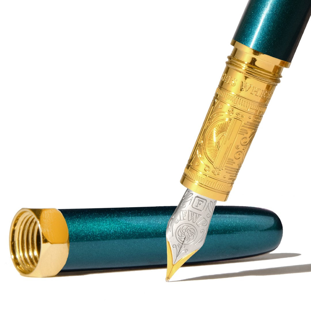 Elegant teal fountain pen with fine nib, perfect for writing, drawing, and artistic endeavors.